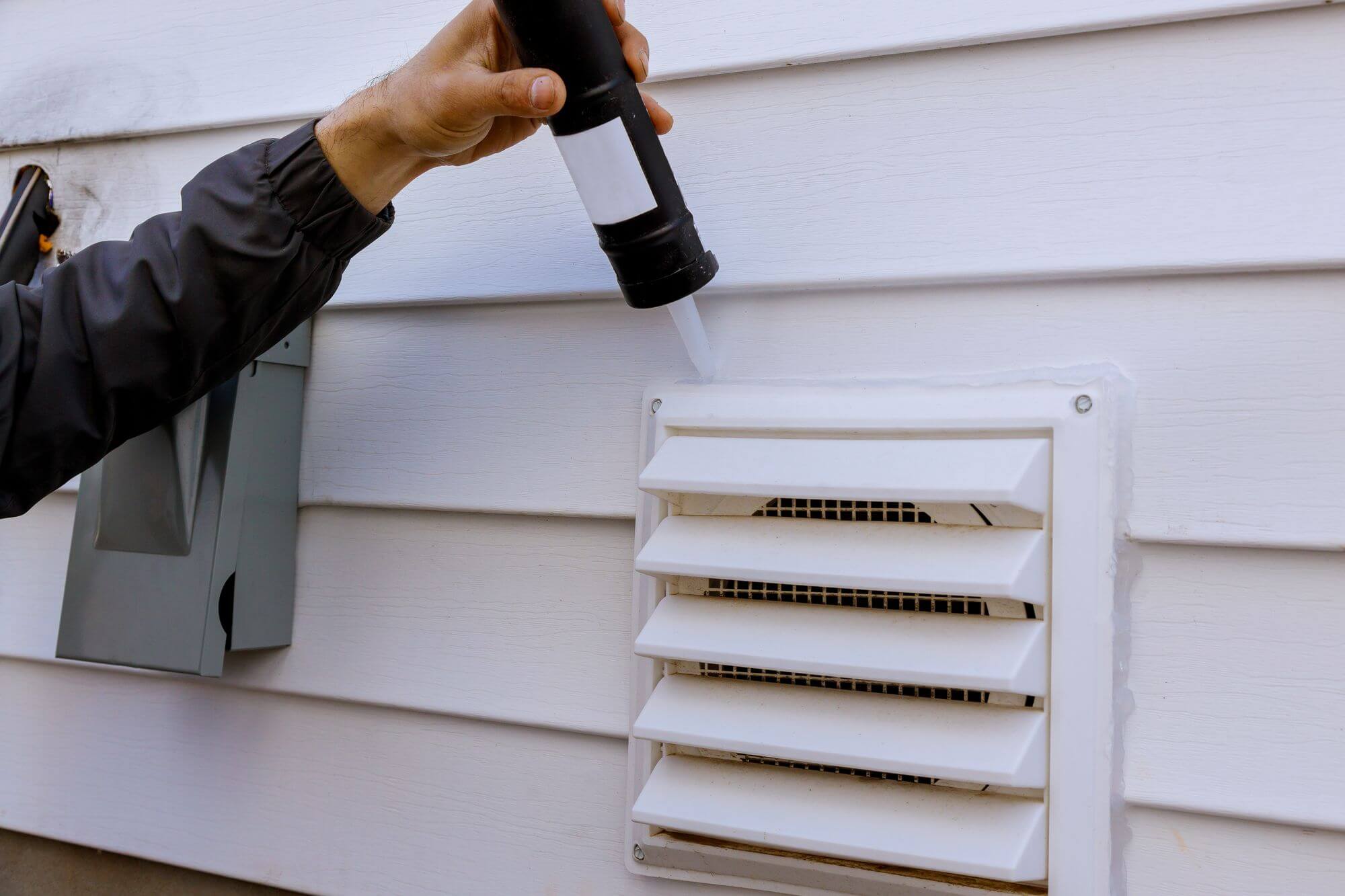 Commercial caulking services sealing joints on a building exterior